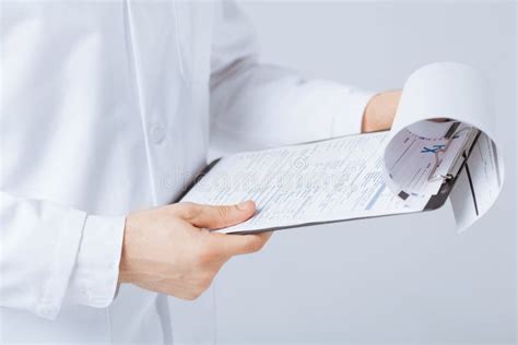 Male Doctor Holding Prescription Paper In Hand Stock Image Image Of