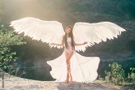 A Heavenly Angel In A Fabulous Sexy Dress With White Wings Walks
