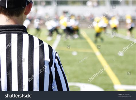 Referee On Field During A Football Game Stock Photo 59973712