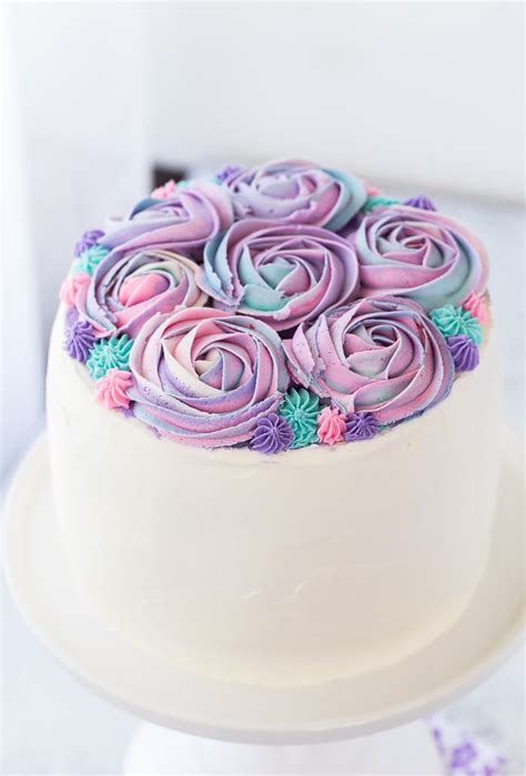 If you have any buttercream left over, feel free to pipe more roses onto cupcakes to decorate your table! White Chocolate Rose Cake for Mother's Day - Blahnik Baker