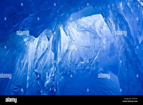 Blue Ice Cave Covered With Snow And Flooded With Light Stock Photo Alamy