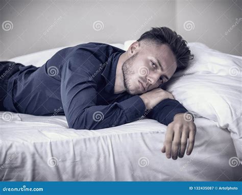 Young Man On Bed With Blue Shirt Stock Image Image Of Lonely Shirt