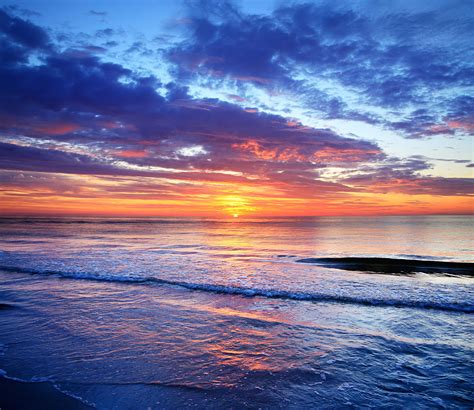 Sea And Sunset Beach Photograph By Konradlew Fine Art America