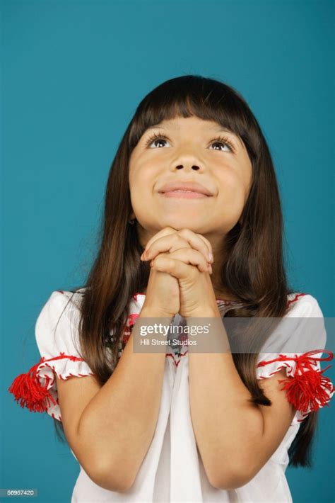 Young Girl Smiling And Looking Up High Res Stock Photo Getty Images