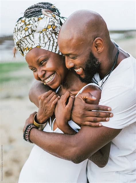 Happy Embracing Black Couple Posing By Stocksy Contributor Dreamwood
