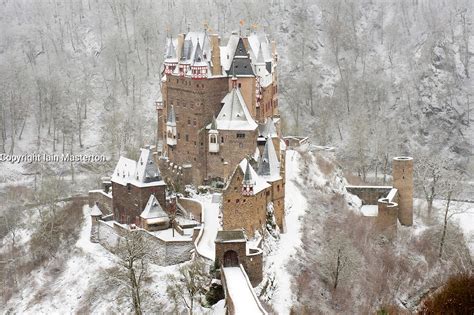 View Of Burg Eltz Castle In Winter Snow In Germany Iain Masterton