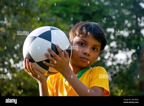 Young Boy Holding Soccer Ball Stock Photo Alamy