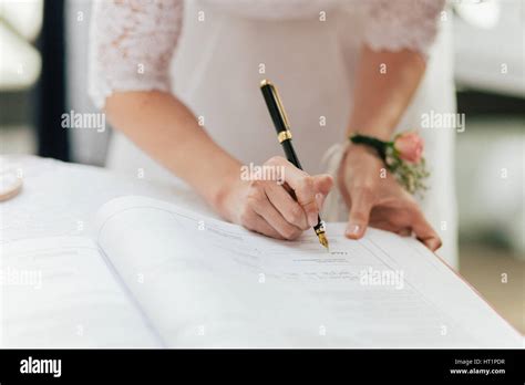 Bride Signing Marriage License Or Wedding Contract Stock Photo Alamy