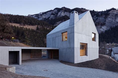 Concrete And Wood Combine To Create A Beautiful Cabin On A Swiss