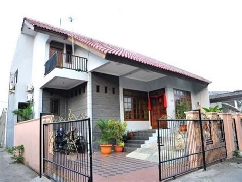 Desainnya masih condong ke arah minimalis, walau hanya pada garis garis fasad yang lurus yang menunjukkan konsep tersebut. Desain Pagar Rumah Hook Untuk Rumah Minimalis yang Menarik