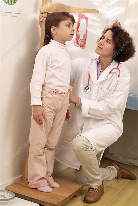 Measuring a child's height - Stock Image - M825/0902 ...