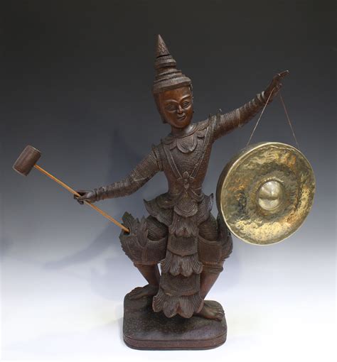 A Burmese Carved Hardwood Figural Gong Stand Early 20th Century