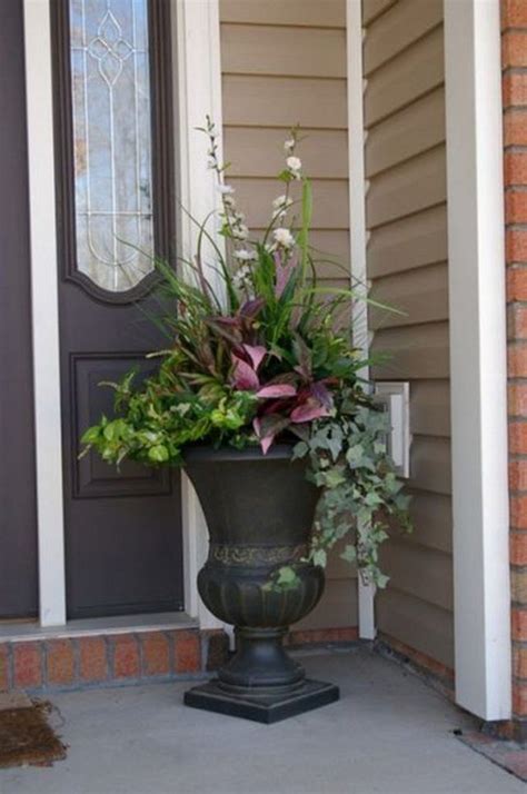 A Large Potted Plant Sitting On The Front Porch