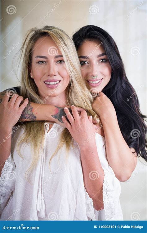 Close Up Of A Lesbians Lovers In A Room At Morning And Brunette Woman
