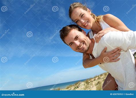 Young Couple Having Fun On The Beach Stock Image Image Of Holding Attractive 65070353