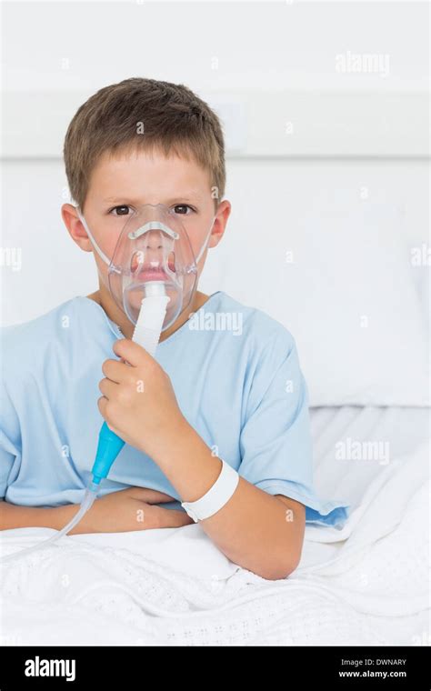 Boy Wearing Oxygen Mask In Hospital Ward Stock Photo Alamy