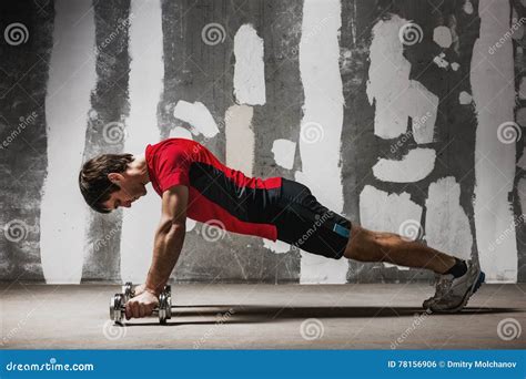 Man Doing Push Ups On Dumbbells The Wall Backdrop Stock Photo Image
