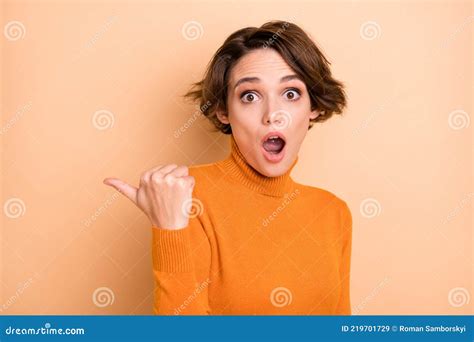 Photo Of Young Shocked Amazed Surprised Girl Pointing Finger Copyspace