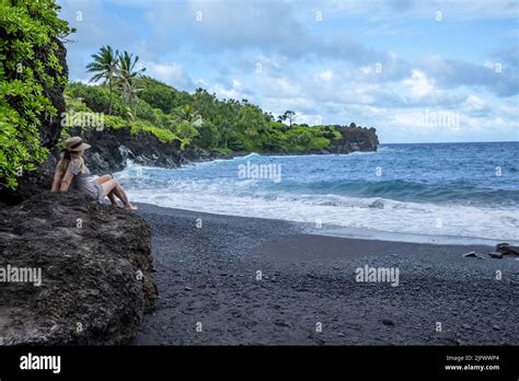A Model At The Black Sand Beach At Waianapanapa State Park Hana Maui