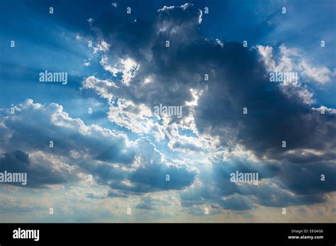 Dramatic Cloudy Sky Clouds With Real Sun Beams Background Stock Photo