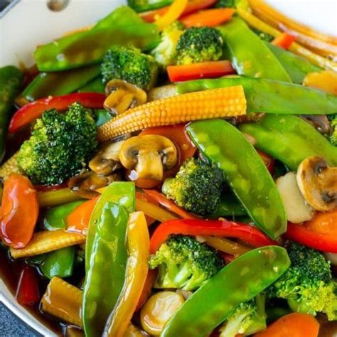 Stir Fry Vegetables Are Mixed Together In A Wok On The Stove Top Ready