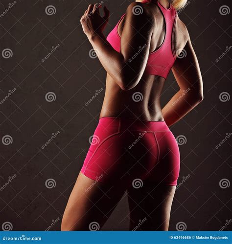 Slim Tanned Woman S Body Over Dark Grey Background Stock Photo Image