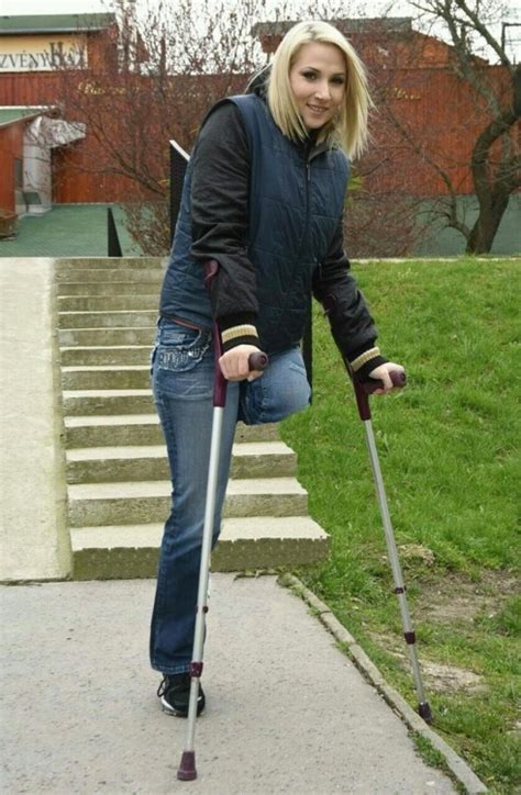Female Amputees Crutches Empty Pant Leg