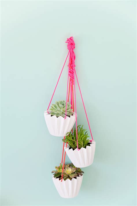 The idea with the bottle planter that has a hole in the cap and a wick is one of the easiest ones to achieve but there's another strategy that you might want to try. 5 MINUTE DIY HANGING PLANTERS - Tell Love and Party