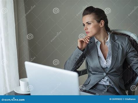 Thoughtful Business Woman Working On Laptop Stock Photo Image Of