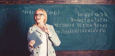 Teacher Smart Woman With Book Explain Topic Near Chalkboard What Makes