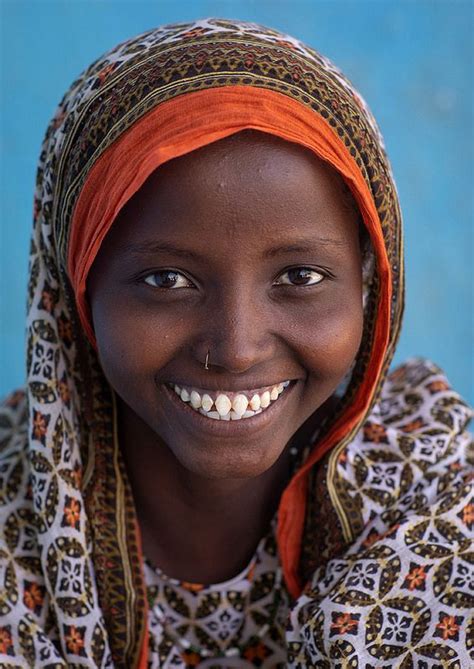 Portrait Of A Veiled Smiling Afar Tribe Girl With Sharpened Teeth Afar