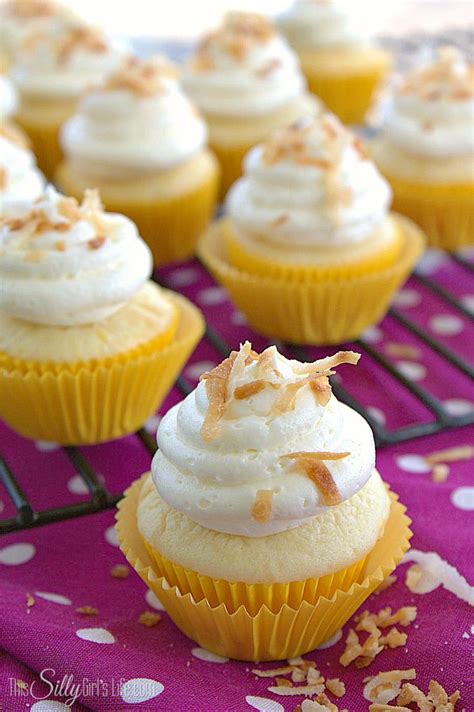 Cupcakes With White Frosting And Toasted Coconut On Top