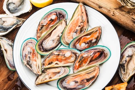 Premium Photo Assorted Fresh Shellfish Mussels And Oysters