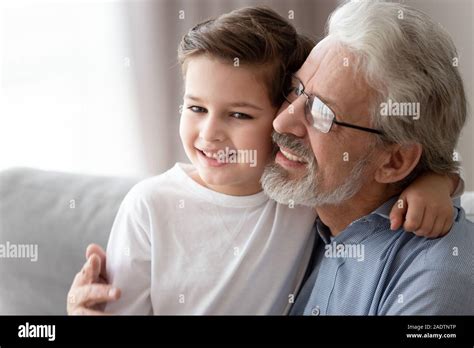 Closeup Portrait Loving Grandfather Embraces Little Grandson Stock