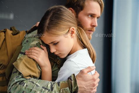 Masculine Sad Military Man Hugging Her Daughter Indoors Stock Photo By
