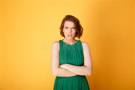 Portrait Of Angry Woman With Arms Crossed Looking At Camera Stock Image