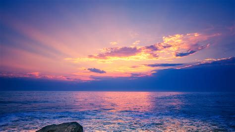 Light Purple Sky Above Beach Rock 4k Hd Nature Wallpapers