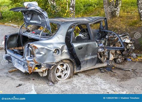 Damaged Silver Passenger Vehicle Closeup After Car Crash Stock Photo