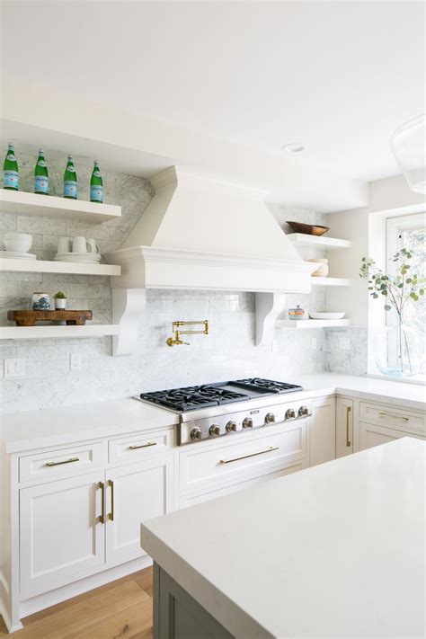 Contemporary Kitchen With White Marble Tile Backsplash And Vent Hood Hgtv