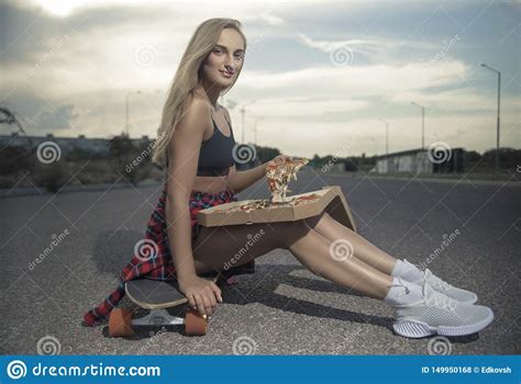 Girl Jumping Off A Skateboard With Headphonesgirl Neither Skateboard Or