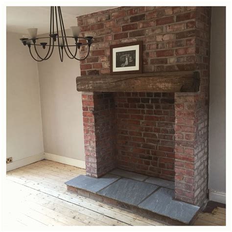 Exposed Brick Fireplace With Indian Stone Hearth And Reclaimed Wooden