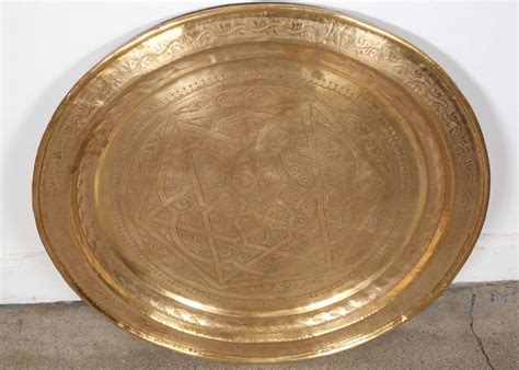 To make decorated eggs last beyond the season, blow them out first. Hand Tooled Huge Moroccan Brass Charger at 1stdibs