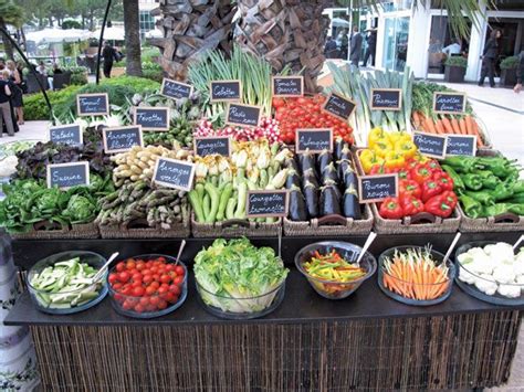 An Assortment Of Vegetables On Display At A Farmers Market