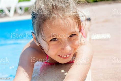 Portrait Of Joyful Girl At The Swimming Pool Stock Photo Download