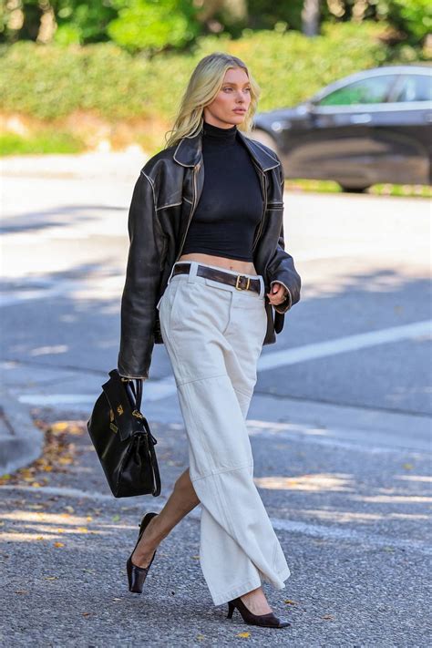Elsa Hosk Looks Stylish In A Leather Jacket With A Matching Crop Top And White Long Skirt While