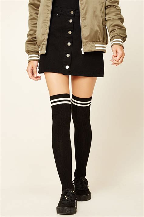 A Pair Of Cable Knit Over The Knee Socks Featuring Varsity Stripes