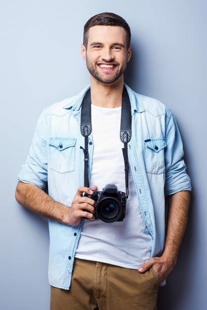 Premium Photo Confident Photographer Handsome Young Man Holding