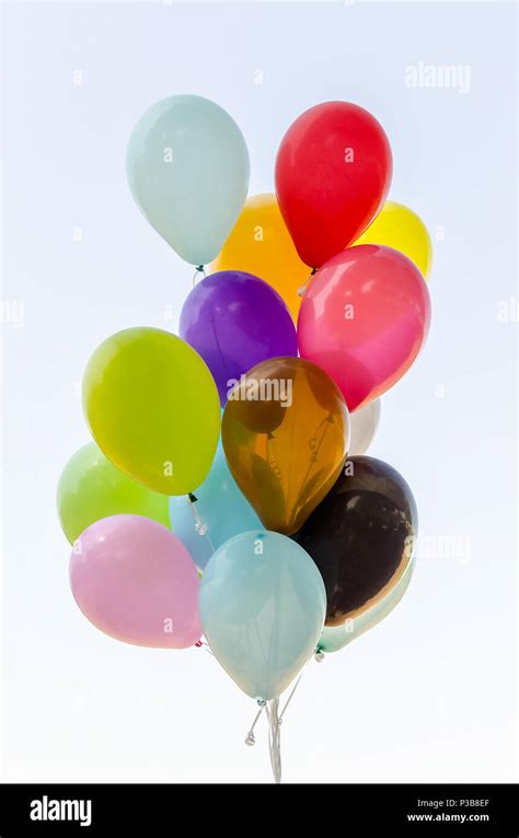 Colorful Bunch Of Helium Balloons Isolated On Background Stock Photo