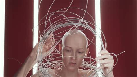 Studio Shot Of Hairless Naked Woman Posing In Tangle Of Wires Stock
