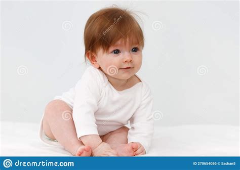 Portrait Of Cute Happy Six Month Baby Girl Childhood And Baby Care